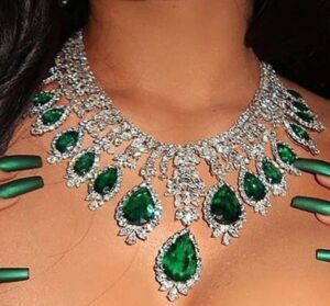 a green emerald necklace on a woman neck