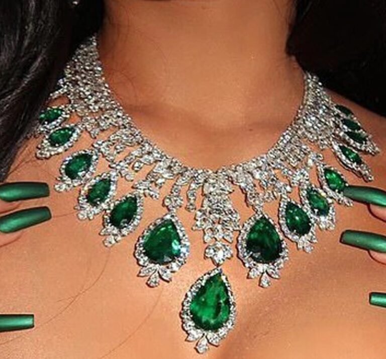 a green emerald necklace on a woman neck