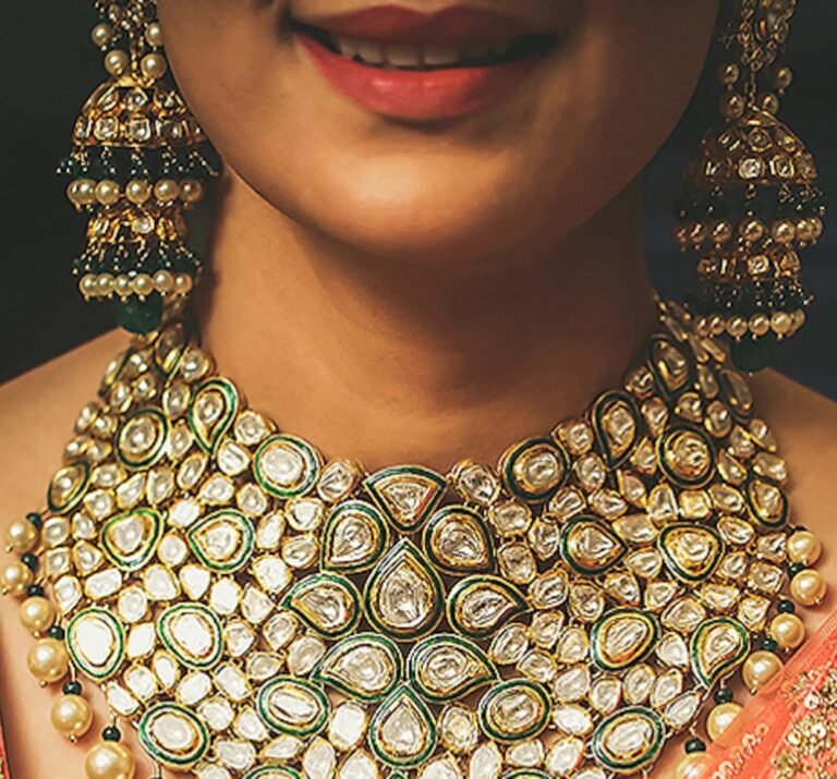 a smilling woman with big necklace