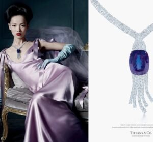 a lady in purple dress with diamond necklaces