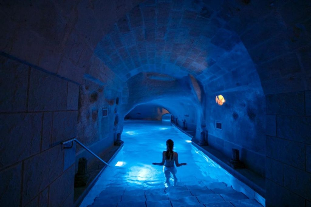 An underground spa, surrounded by Matera's historical tunnelled walls.