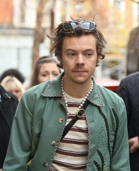 Harry Styles in public, wearing his pearls
