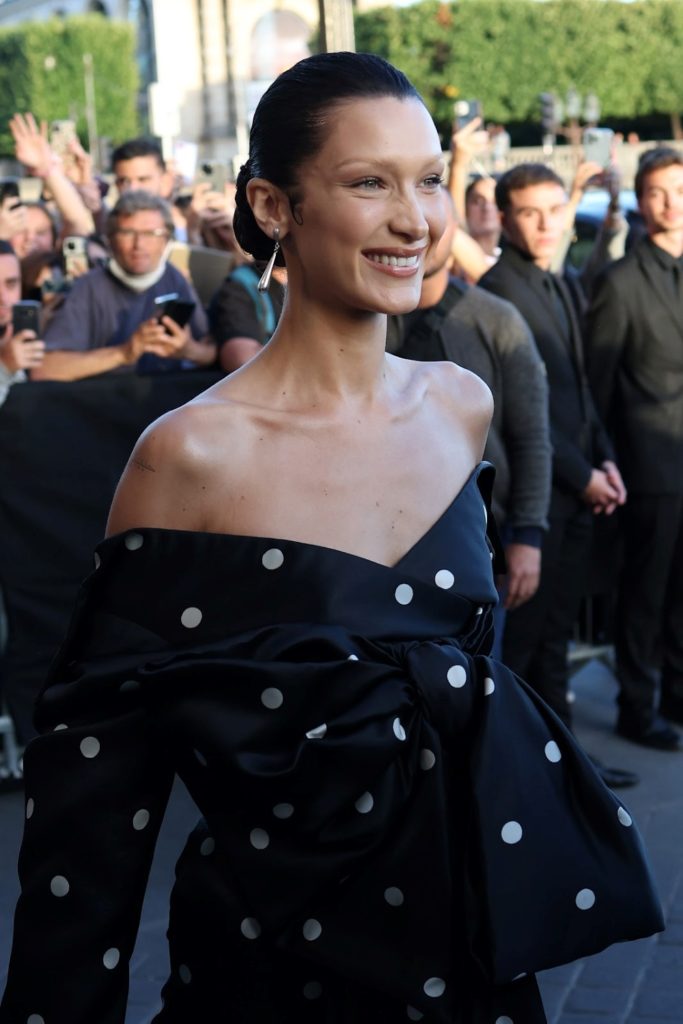 Bella Hadid attending the Balenciaga couture dinner in a polka-dot dress and teardrop earrings