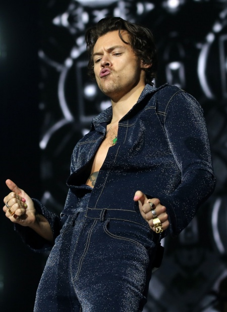 Harry Styles on stage, with his rings