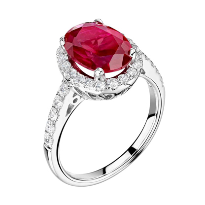 Ring with a large oval red gem surrounded by small white gems on a silver band.